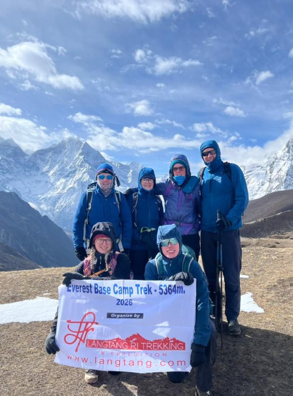 Everest Base Camp Trek with stunning Himalayan views, trekkers walking towards Mount Everest through Sherpa villages and rugged mountain landscape