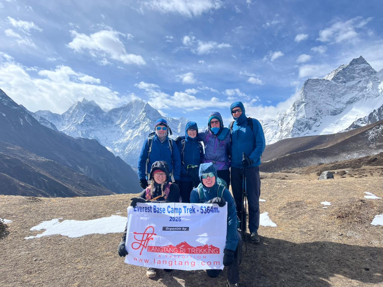 Everest Base Camp Trek with stunning Himalayan views, trekkers walking towards Mount Everest through Sherpa villages and rugged mountain landscape