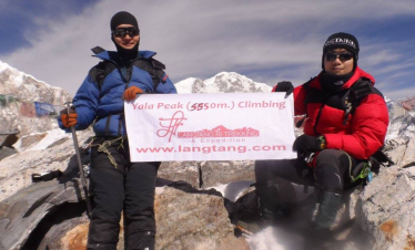 Climbers ascending Yala Peak with panoramic views of the Langtang Himalayas.