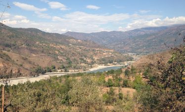 Arun Valley with snow-capped Himalayan peaks in the background during the trek