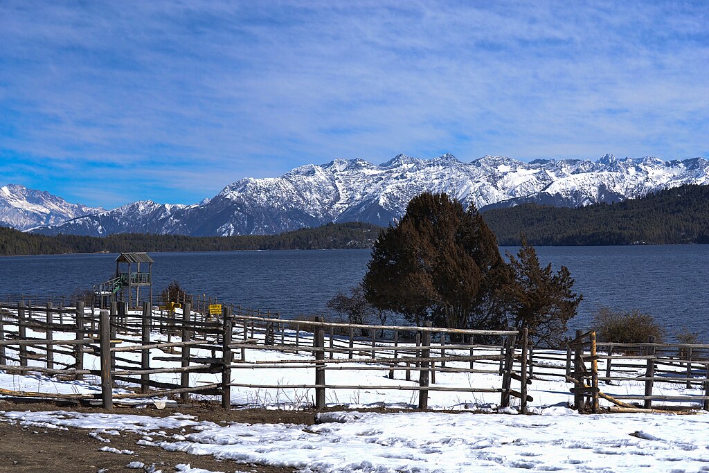 Rara Lake Trek with crystal-clear lake, surrounding Himalayan peaks, and lush forests in Nepal