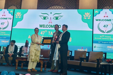 Mrs. Pamfa Dhamala receiving the Late Ambica Shrestha Women’s Tourism Entrepreneurship Award 2025 from TAAN in Nepal