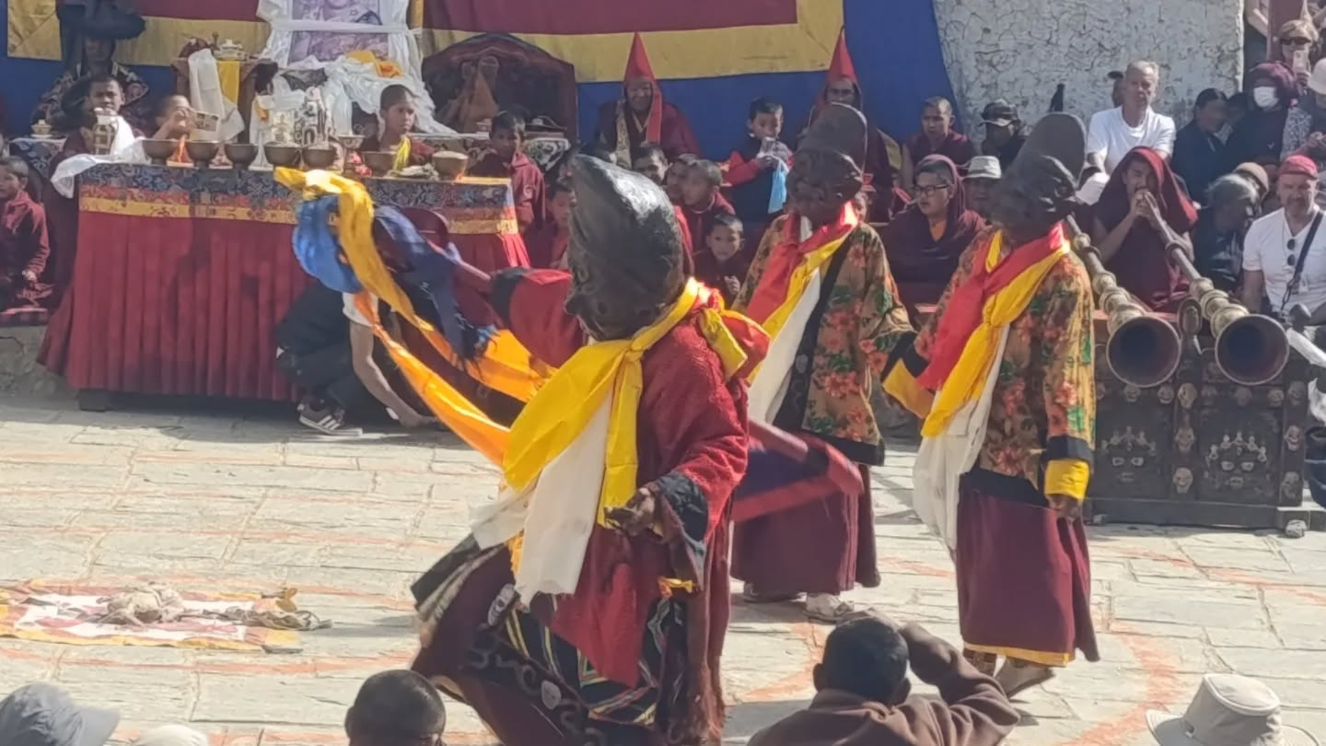 Masked Buddhist monks performing sacred Tiji Festival dance in Lo Manthang, Upper Mustang, Nepal