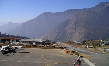 Helicopter flying from Lukla to Everest Base Camp with panoramic Himalayan views.