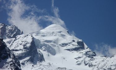 Baden Powell Peak Climbing ascending Baden Powell Peak with Langtang Valley and snow-capped mountains in the background