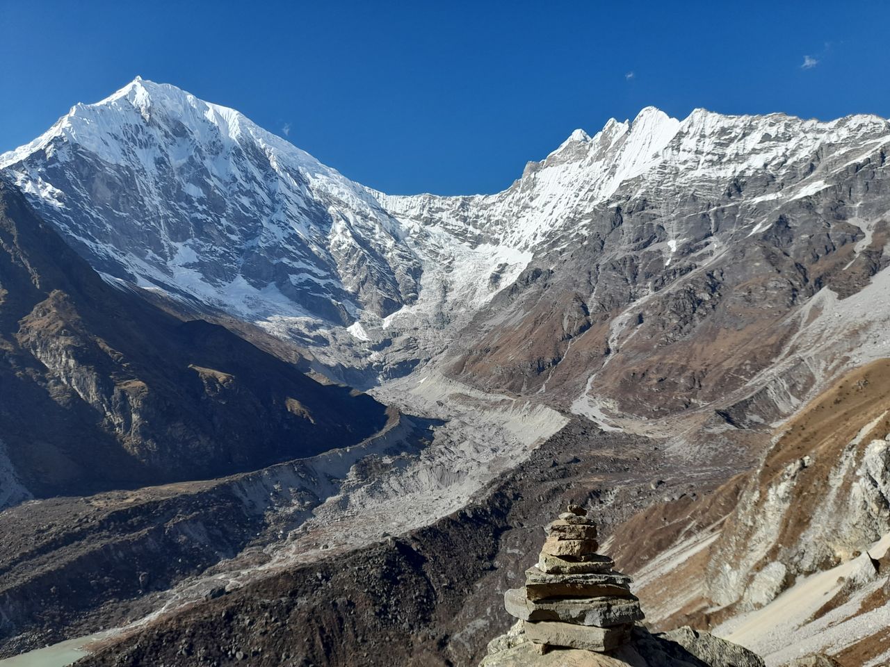 Stunning view of Langtang Lirung snow-capped peaks under clear blue sky.